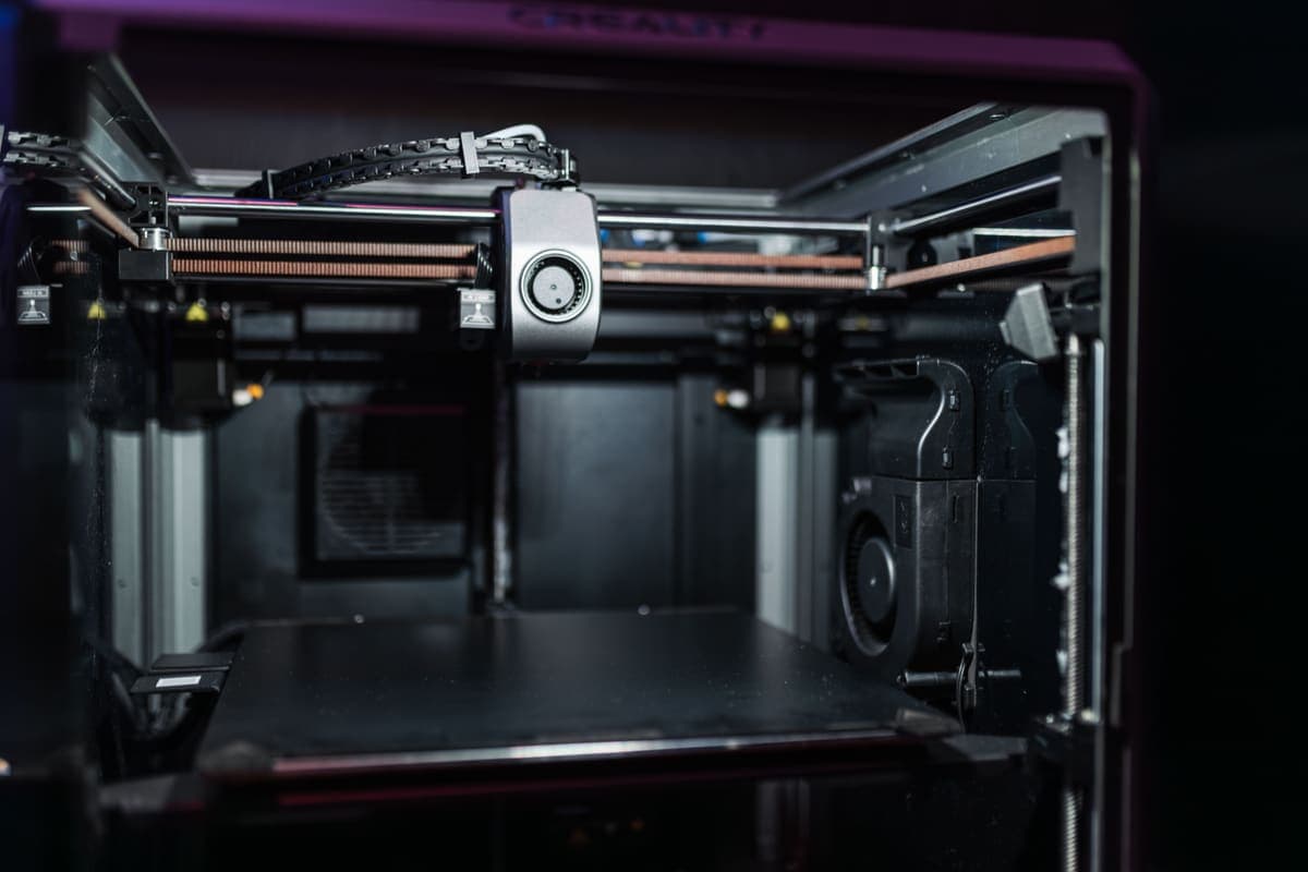 The inside of a modern desktop 3D printer photographed close up