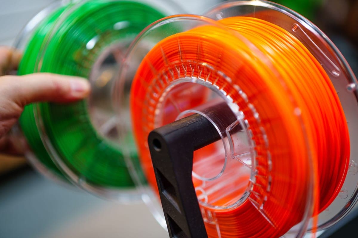 Spools of 3D printer filament in several colors