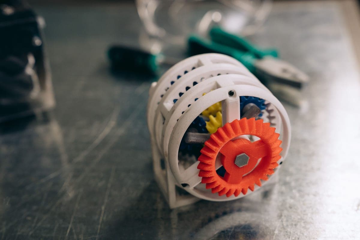 A close view of a small printed plastic gear