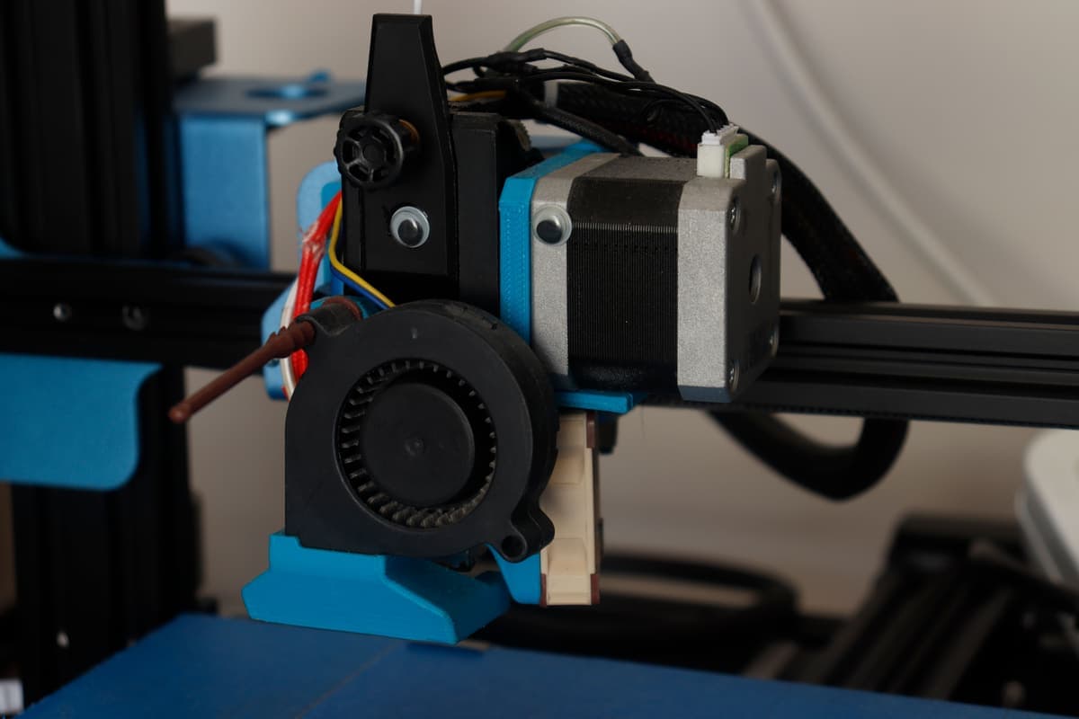 A close view of the inside of an enclosed desktop 3D printer