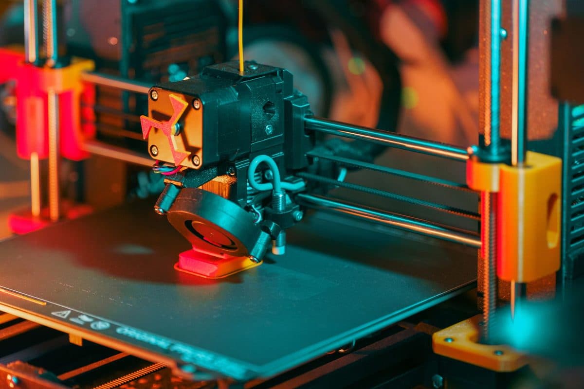 A desktop 3D printer part-way through a print