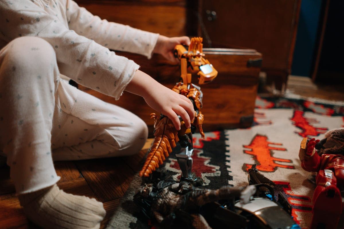 A child playing with small plastic toys