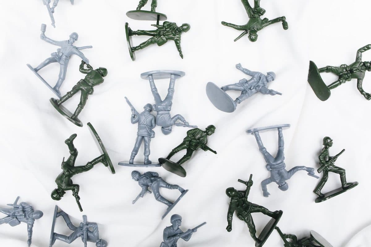 Small plastic toy soldiers on a white background