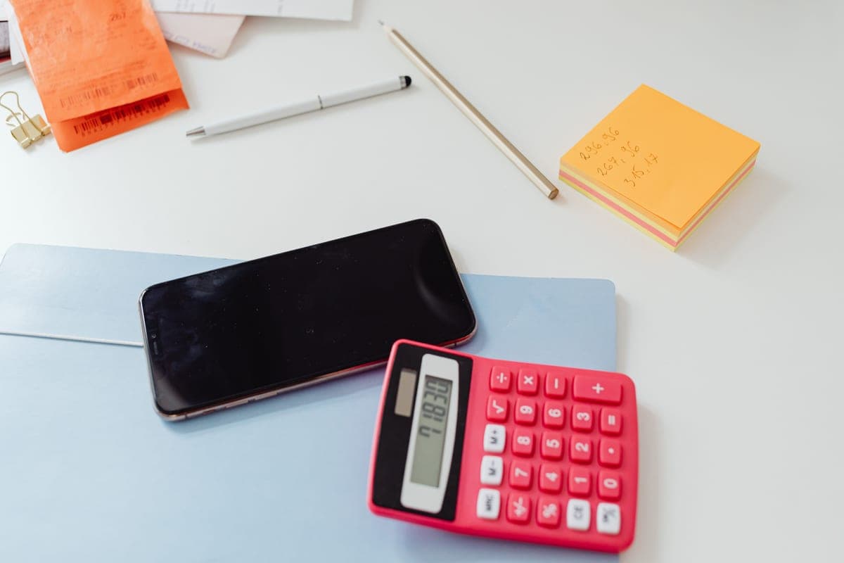 A calculator resting on a plain surface