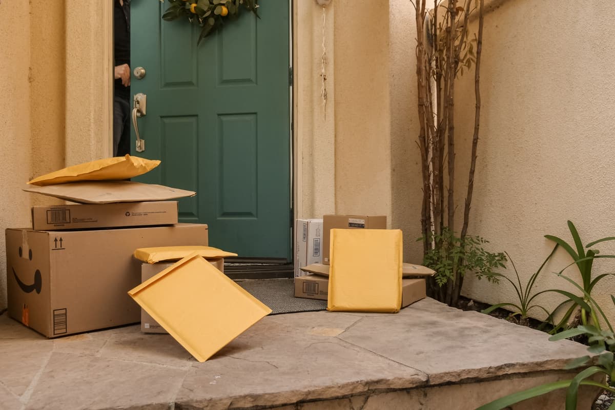 Delivery packages stacked at a front door